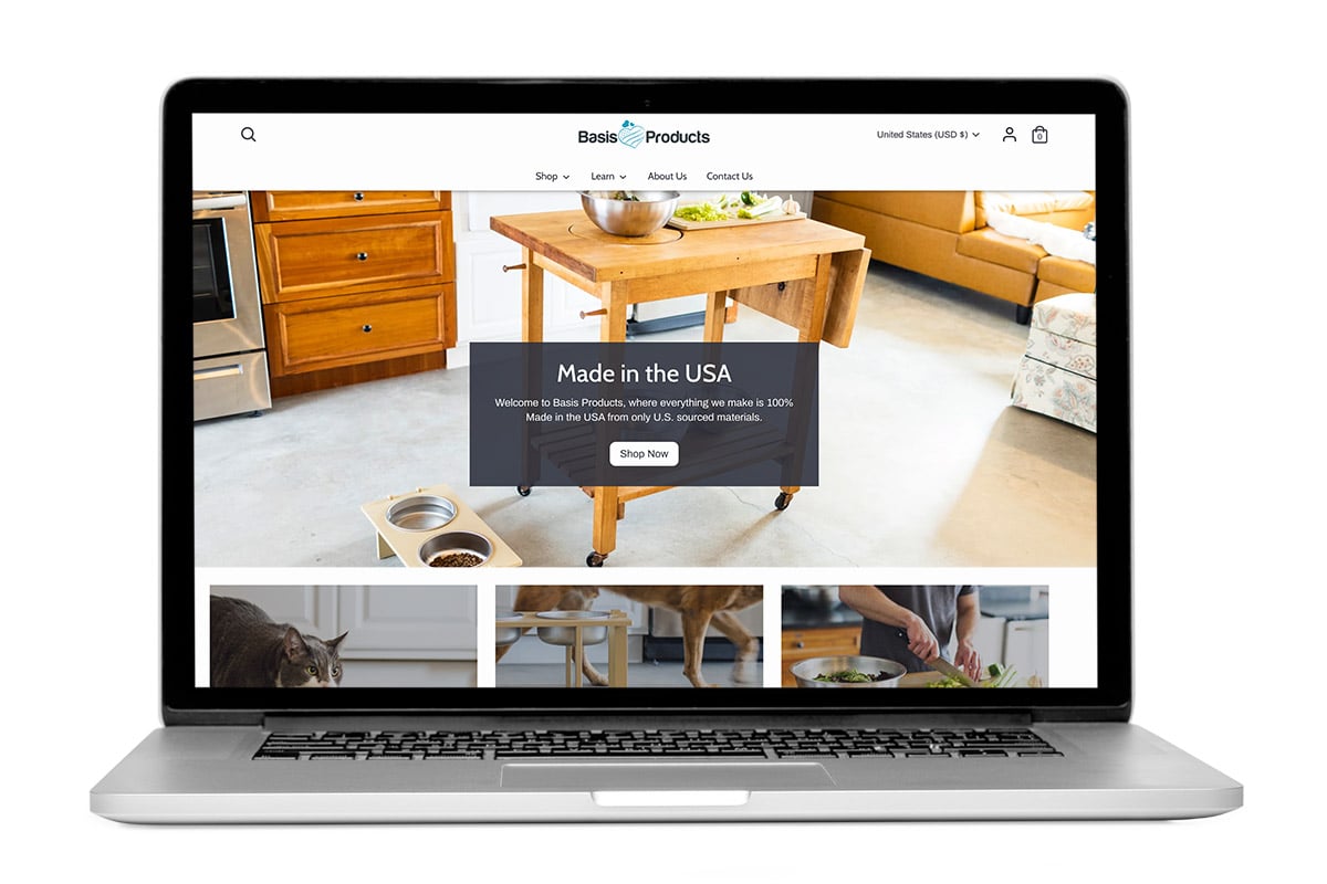 Laptop open to show the homepage of Basis Products, a Shopify development client of Bytes.co